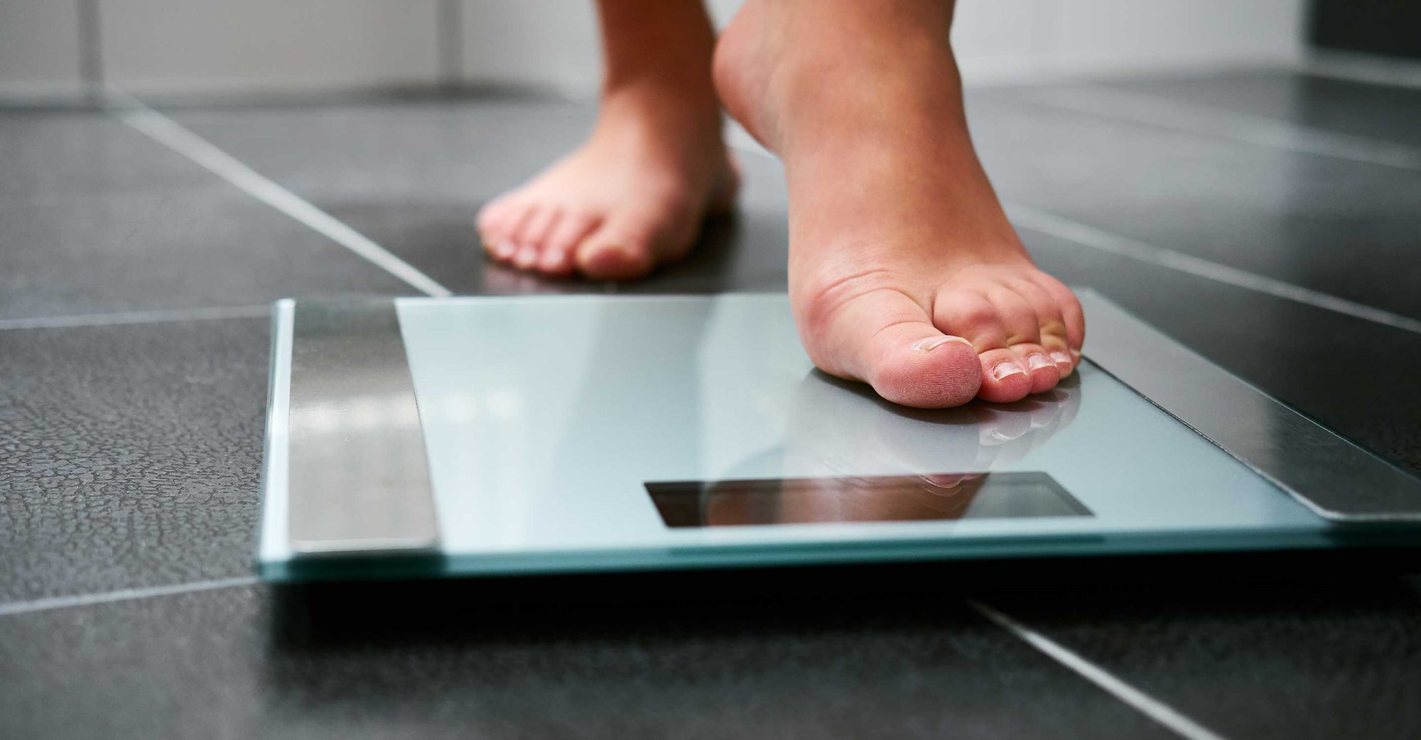 A person stepping on the scale