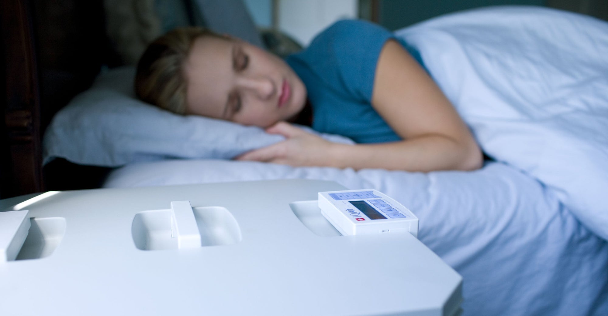 woman sleeping peacefully next to HealthPro Plus.