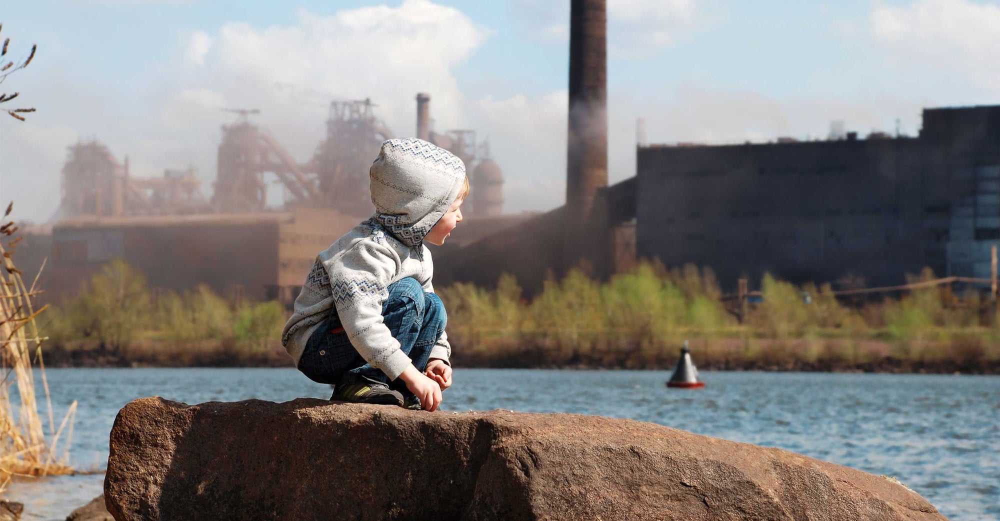 Child observes smoke stacks