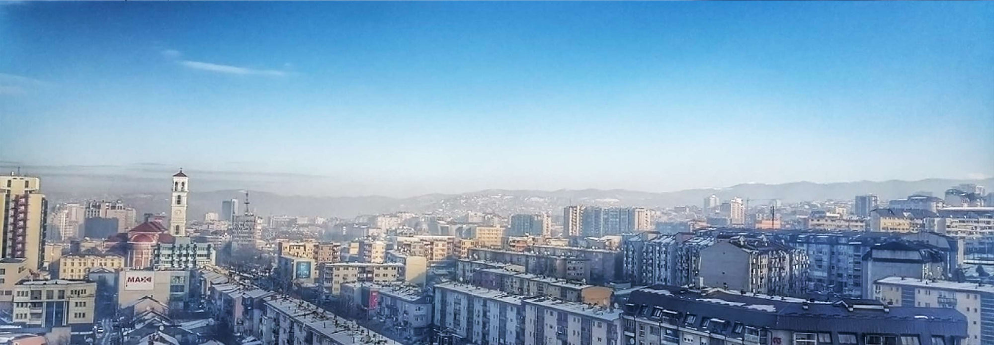 Smoggy Kosovo skyline.