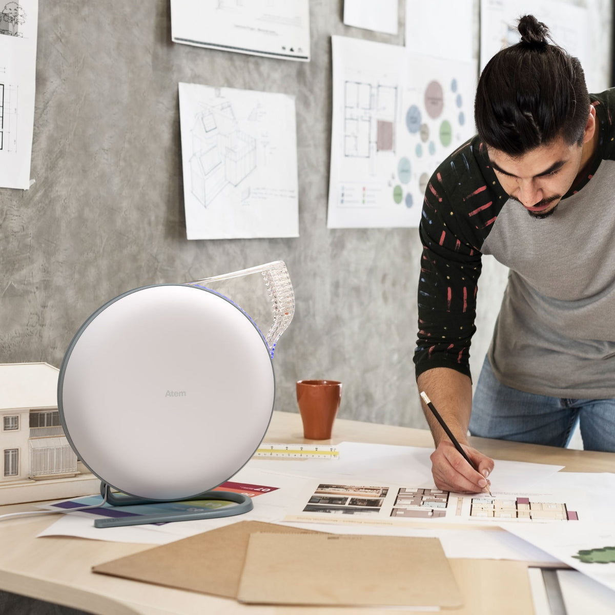 Atem Desk on table with architect